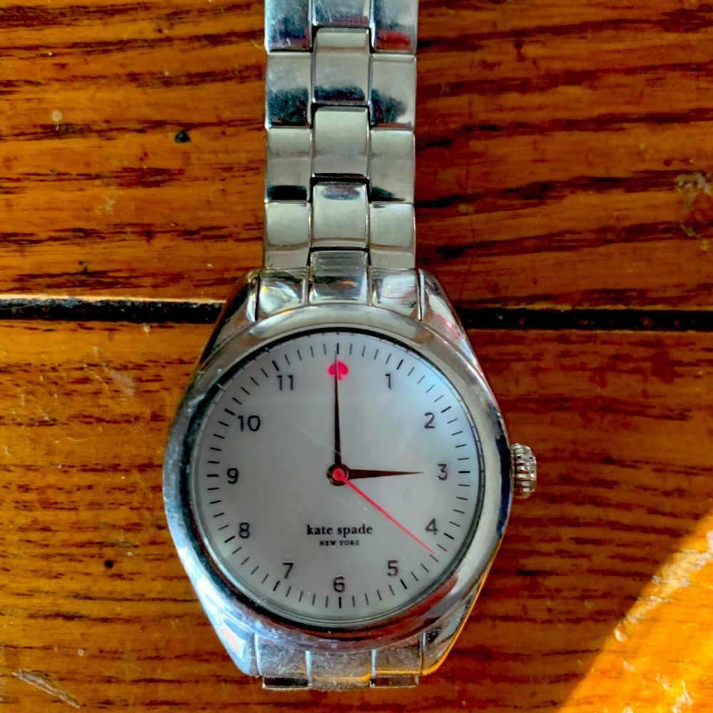 kate spade Silver Tone Stainless Steel Watch with White Dial and Pink Accents.